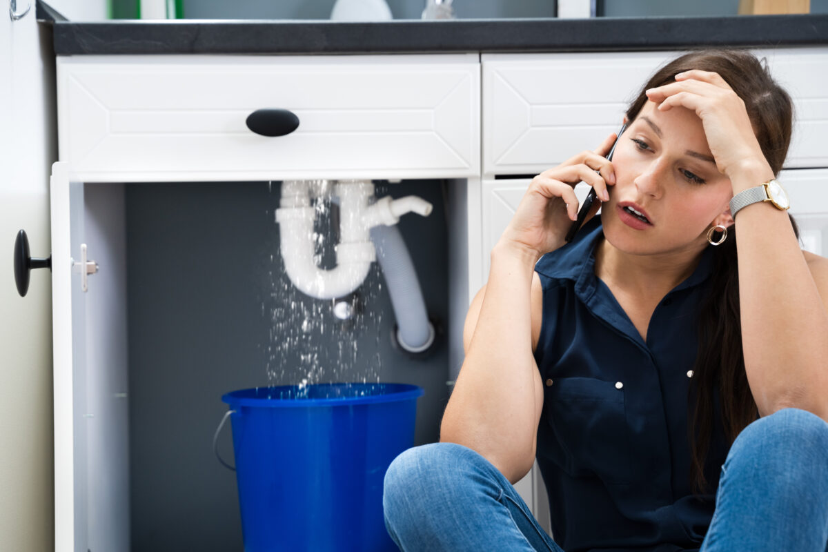 Experienced plumber fixing a pipe in Merrimack County, NH