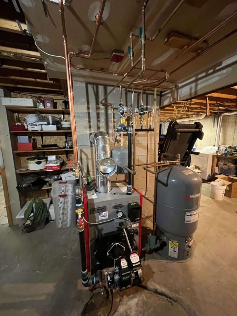 Experienced technicians performing boiler replacement in Goffstown, NH.